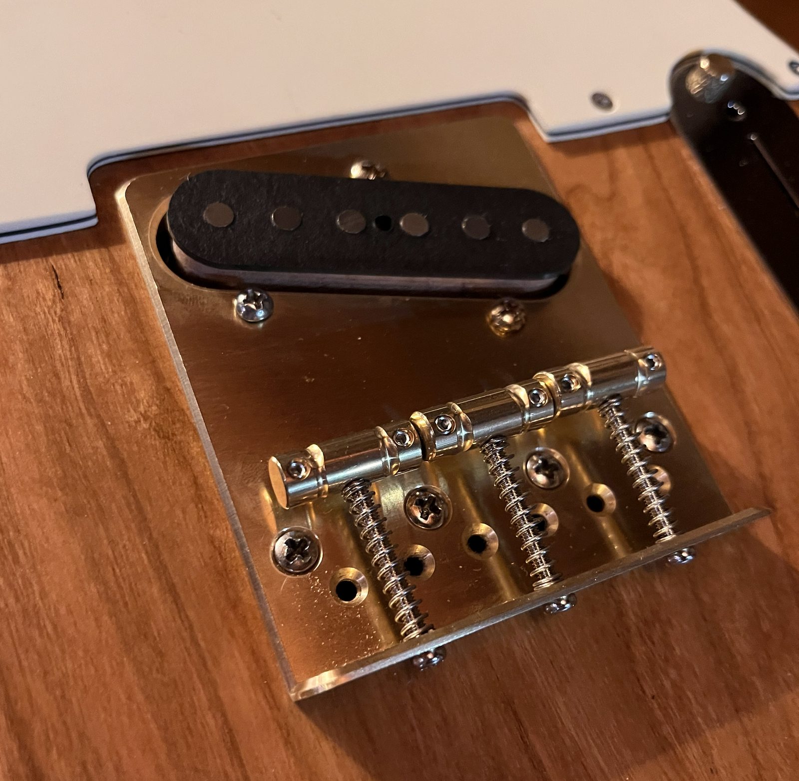 Custom brass bridge plate with pickup and saddles